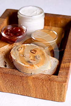 Creamy peanut butter on a slice of toast. Peanut butter sandwich