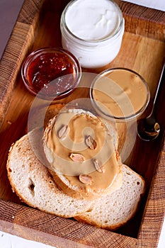 Creamy peanut butter on a slice of toast. Peanut butter sandwich