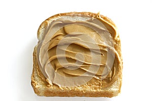 Creamy peanutbutter on white bread