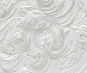 Creamy pics in yoghurt or cream surface. Top view