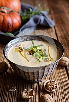 Creamy pumpkin and walnut soup in a bowl
