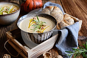 Creamy pumpkin and walnut soup in a bowl