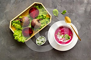 Creamy red beetroot soup with raw beets and sour cream