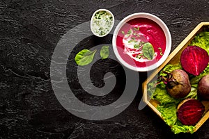 Creamy red beetroot soup with raw beets and sour cream