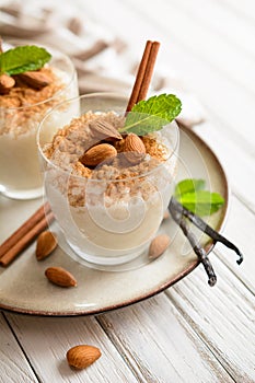 Creamy rice pudding topped with cinnamon and almond