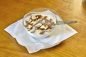 Creamy rice pudding topped with a generous sprinkle of cinnamon.