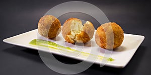 Creamy and smooth fried croquettes. Typical Spanish tapa.