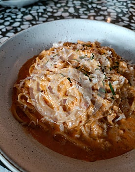 Creamy tomato cream pasta with parmesan chest