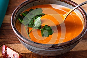 Creamy tomato soup with fresh parsley