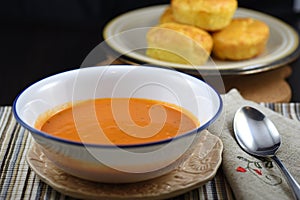 Creamy tomato soup with homemade cheese muffins