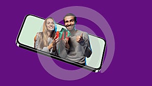 Crearive collage of joyful couple sticking out phone screen with present box isolated over purple background