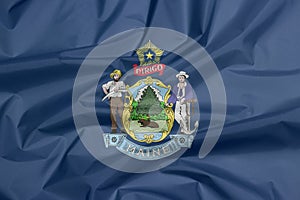 Crease of Maine fabric flag background. Maine coat of arms defacing blue field