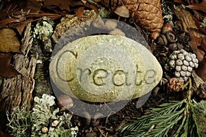 Create etched on a stone on the forest floor photo