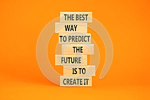 Create future symbol. Concept words The best way to predict the future is to create it on wooden blocks. Beautiful orange