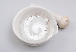 Creatine Powder on light grey background