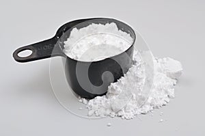 Creatine Powder on light grey background