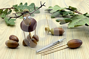 Creating deer made of acorn and chestnut figures in autumn time. childhood tinker