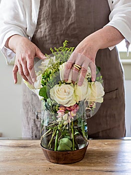 Creating a floral arrangement from a bouquet of fresh flowers