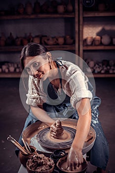 Master class on modeling of clay on a potter& x27;s wheel In the pottery workshop. photo
