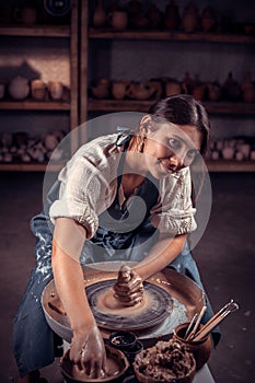Master class on modeling of clay on a potter& x27;s wheel In the pottery workshop. photo
