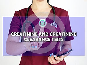 CREATININE AND CREATININE CLEARANCE TESTS text in menu. physician looking for something at cellphone