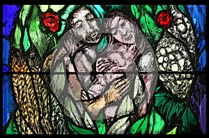 Creation and birth, detail of stained glass window in St. James church in Hohenberg, Germany