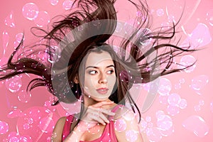 Creative 3d collage of woman touching face look pink pastel background with flying bubble enjoy shampoo offer advert