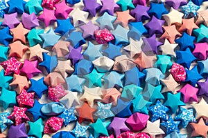 Creative abstract background with many colorful origami paper lucky stars