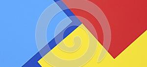 Creative abstract blue, red and yellow color geometric paper compositon background, top view