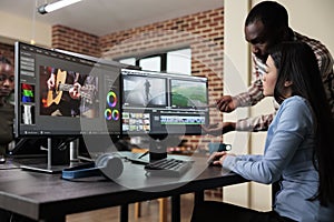 Creative agency video graphic editor expert enhancing footage using visual timeline and advanced software.