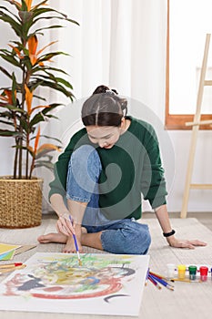 Creative of art concept, Young asian woman sitting on the floor and work to drawing art masterpiece