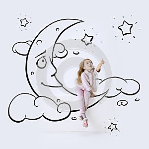 Creative artwork. Little girl sitting on drawn moon and dreaming. Inspiration world for kids. Concept of ideas