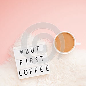 Creative autumn flat lay overhead top view coffee cup vintage lightbox But coffee first text on millennial pink background copy