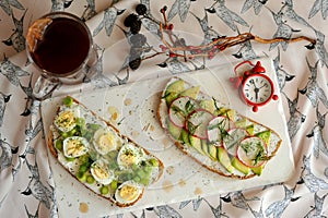 Creative, awesome and healthy sandwiches for breakfast with tea for boosting energy in the morning