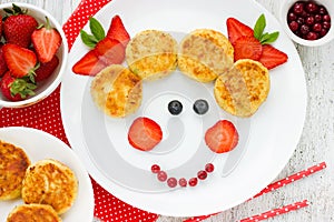 Creative baby breakfast cheesecakes with strawberry. Fun food id