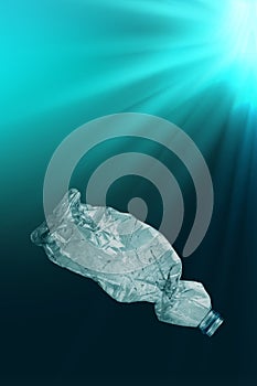 Creative background of PET plastic bottle floating in sea or ocean