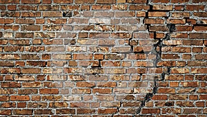 Creative background red brick wall with crack. Antique brick wall. Copy space