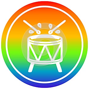 A creative beating drum circular in rainbow spectrum