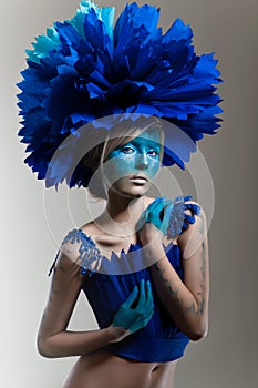 Creative beauty shot with cyan headdress