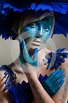 Creative beauty shot with cyan headdress