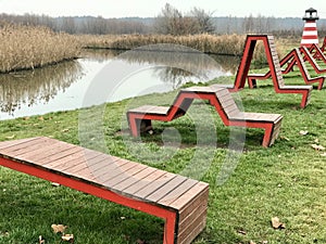 Creative benches and a lighthouse on the Irpin River Walk, photo