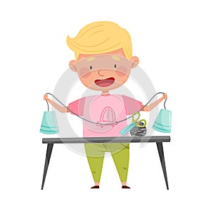 Creative Boy at Desk Crafting from Used Paper Cup Vector Illustration