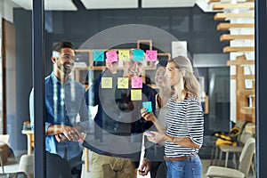 Creative brains see the bigger picture. a group of colleagues having a brainstorming session in a modern office.