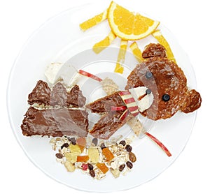 Creative breakfast with fruit and sweet nutella on bread