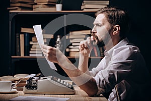 Creative Brown-haired Male Author Rereading His Work