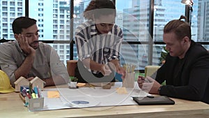 Creative business people group having conversation at office desk in workplace.