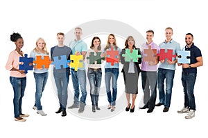 Creative Business People Holding Jigsaw Pieces