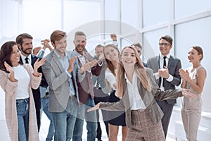 creative business team applaud the young businesswoman