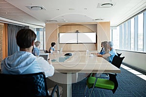 Creative business team attending a video call in conference room