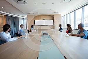 Creative business team attending a video call in conference room